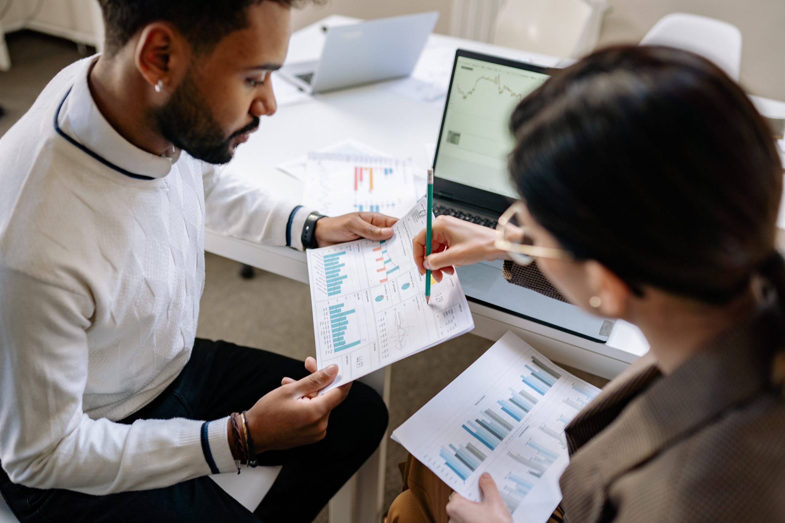 Man and woman reviewing data analytics report